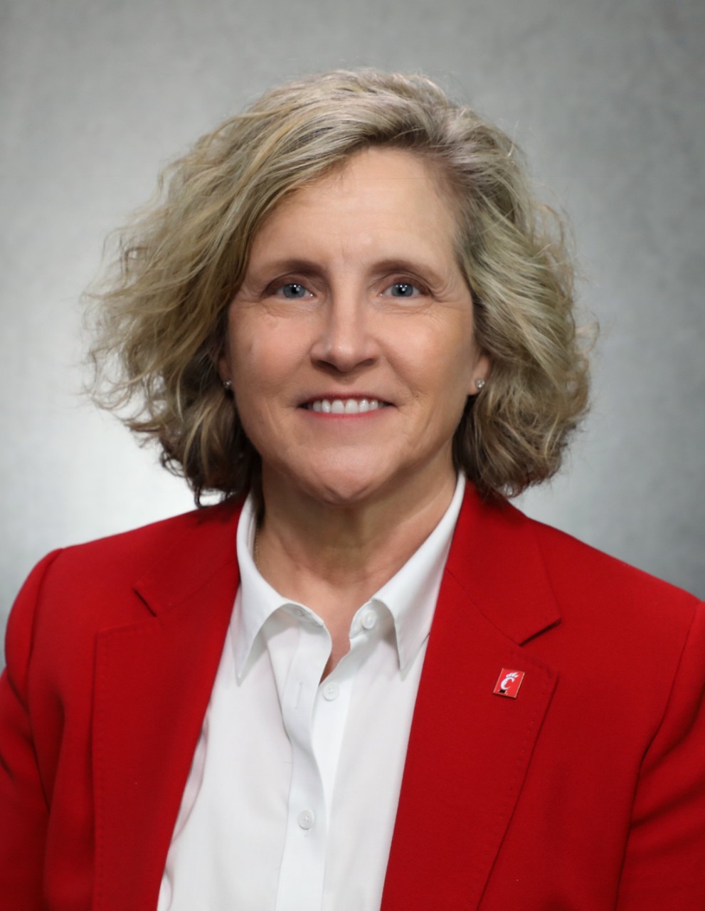 A photo of Dean Lewis in a red blazer and white shirt.
