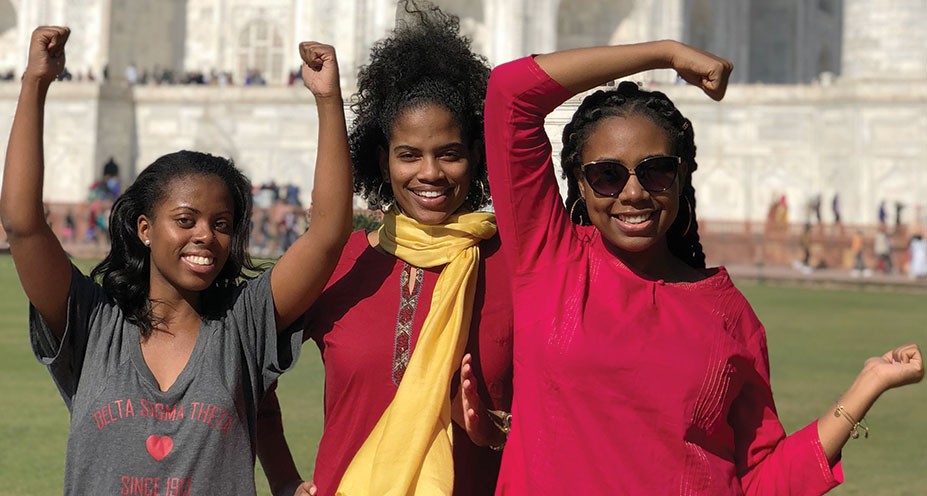 Lindner students form the letters "UC" with their arms in Mumbai
