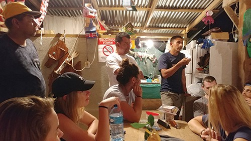 Lindner Economics students conversing with Costa Rican fishermen