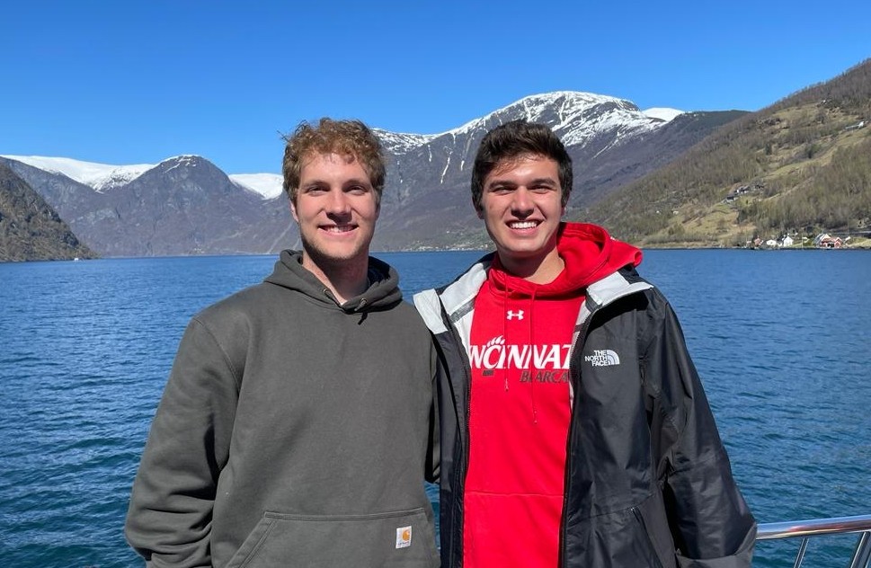 Two students by a lake