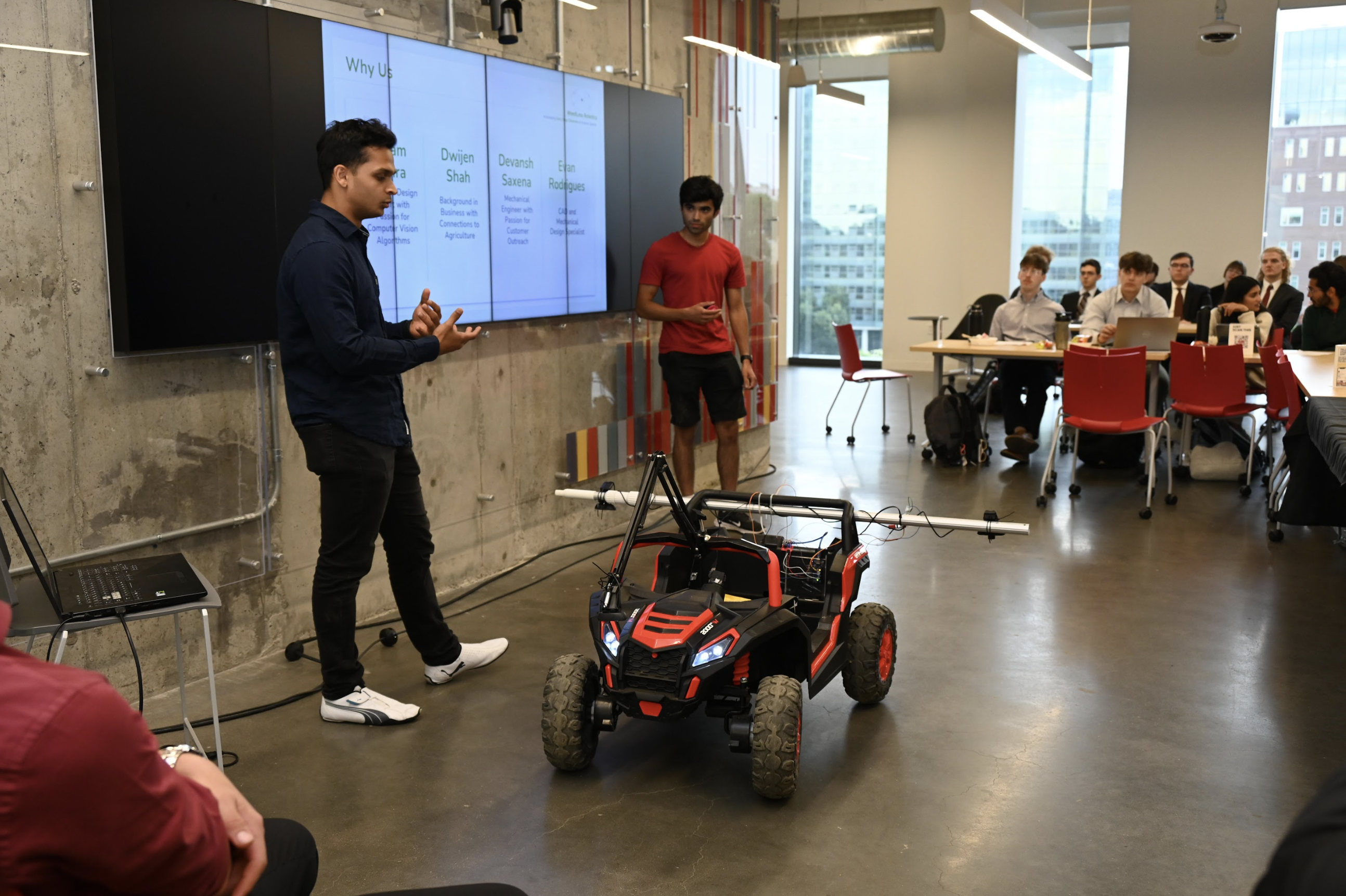 Two students pitch their prototype in the Innovation Challenge